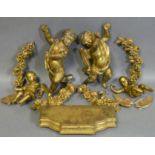 A pair of carved giltwood cherubs, 11” high; a ditto smaller pair, 7” high; four floral carved