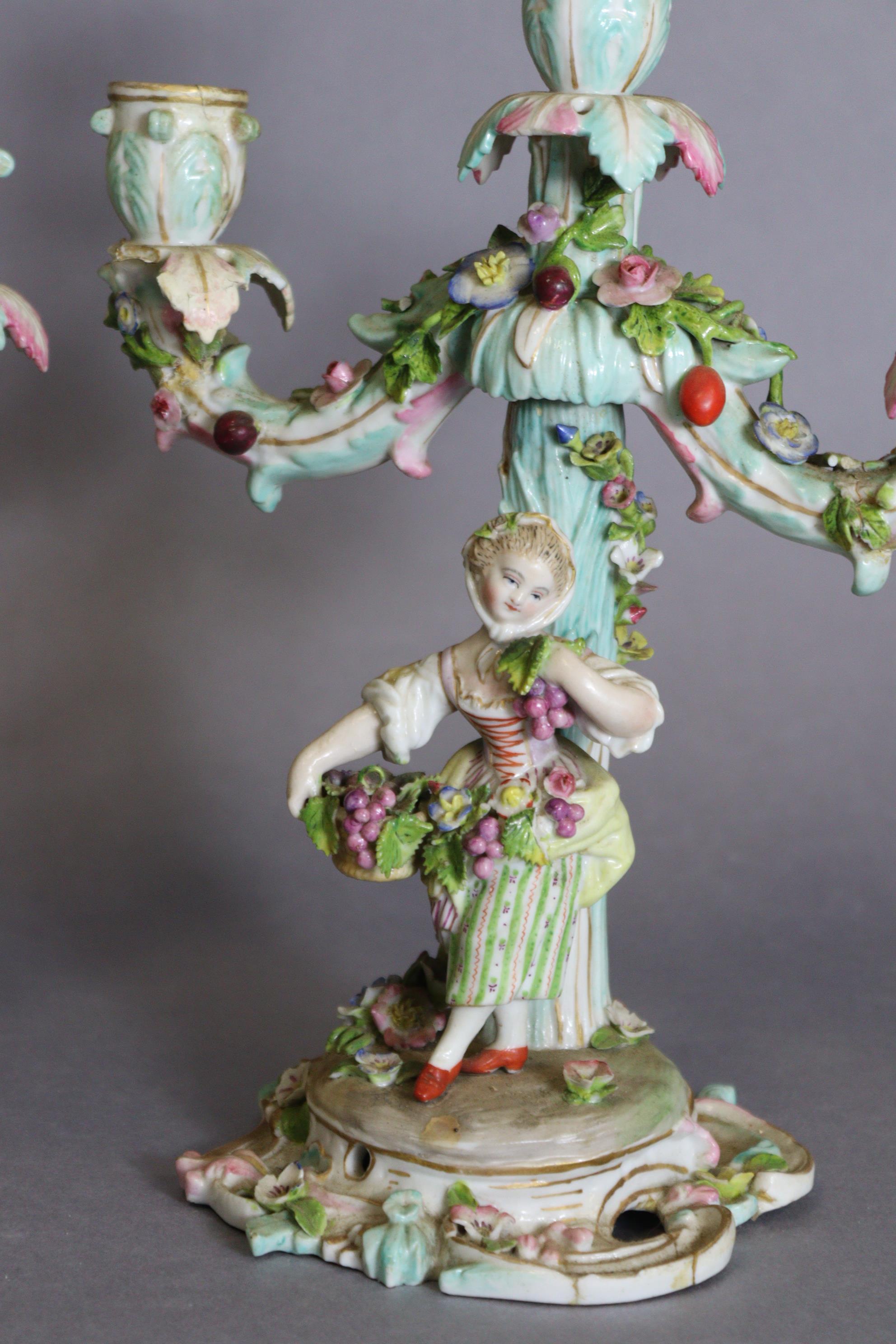 A pair of Meissen porcelain three-branch floral-encrusted candelabra, one with a girl holding a - Image 2 of 11