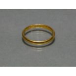 A 22ct gold plain narrow band, size N, weight 3.2g.