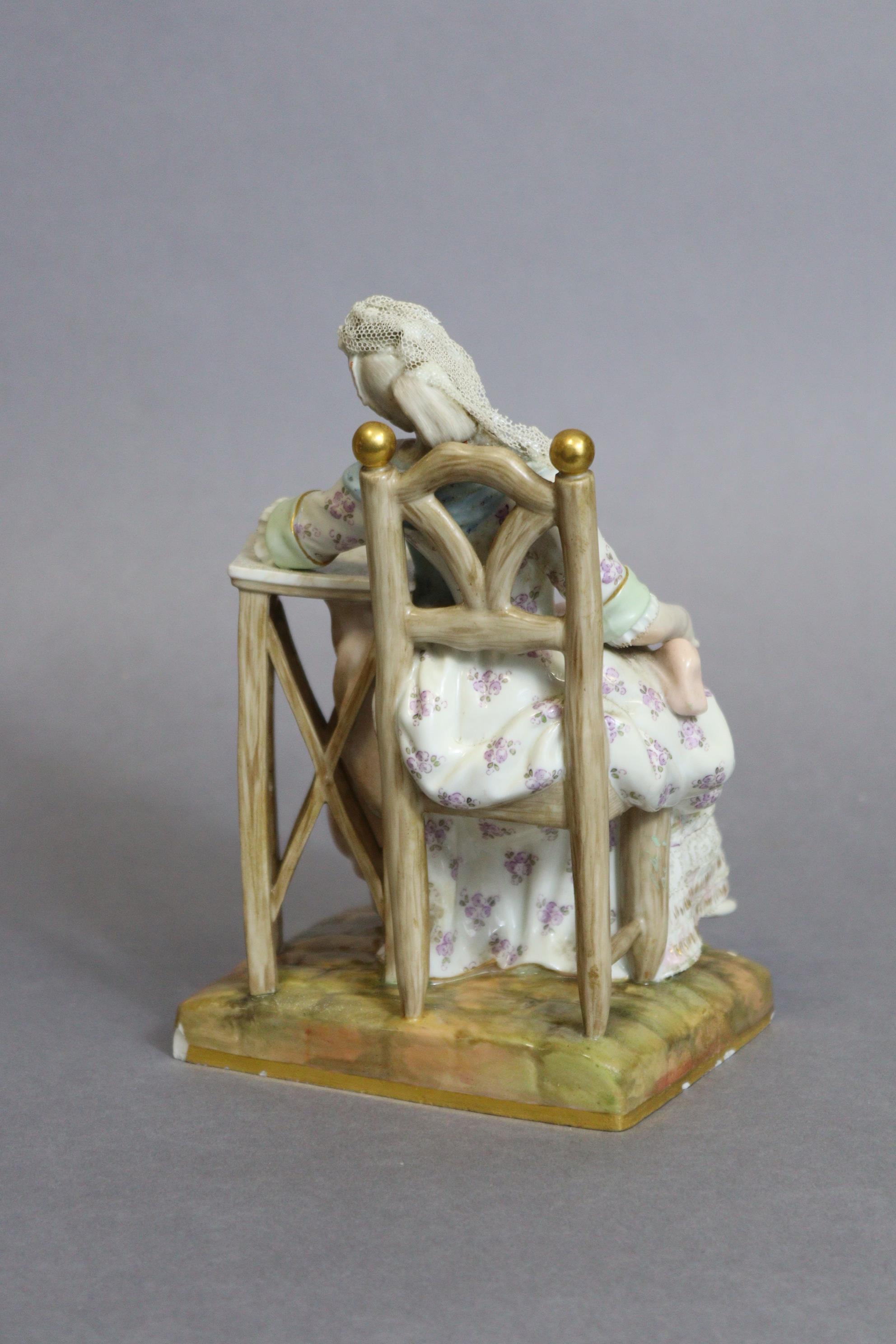 A Meissen figure of a lady asleep in a chair, one arm resting on a marble-top table, blue crossed - Image 4 of 5