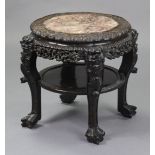 An early 20th century Chinese hardwood two-tier circular occasional table inset rouge marble top,