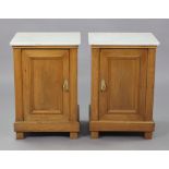 A pair of late 19th/early 20th century Continental fruitwood bedside cupboards, en-suite, each with