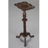 A 19th century solid rosewood wine table, the one-piece shaped rectangular top with moulded edge, on