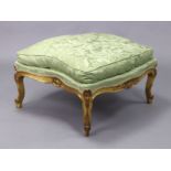 An 18th century French carved giltwood frame stool, with shaped sides & inverted serpentine front,