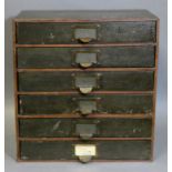 A mid 20th century counter-top filing chest of six drawers (the fibre covering worn), 14½” wide x