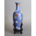 A Chinese porcelain slender ovoid vase of blue ground with all-over sgraffito scroll decoration, &