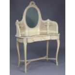 A 19th century French painted dressing table with raised cane back, inset oval swing mirror having