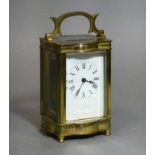 A gilt-brass cased carriage timepiece with black roman numerals to the white enamel dial; 4½”