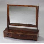 A Georgian mahogany swing toilet mirror with rectangular plate on fluted supports & bow-front base