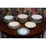 Six Minton porcelain 10¼” dinner plates, the pale green borders with family crest & monogram between