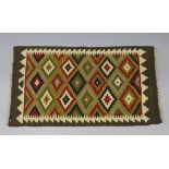 A Maimana kilim rug of ochre ground with repeating multi-coloured lozenge design & narrow borders,