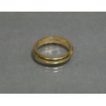 An 18ct yellow gold plain band; size M, weight 3.9g.