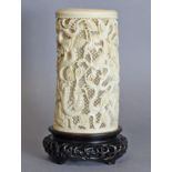 An early 20th century Chinese ivory tusk vase, finely carved with four dragons weaving in & out of