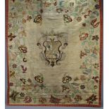 A PAIR OF 18th century CONTINENTAL SILK EMBROIDERED ARMORIAL WALL HANGINGS, each with central coat-