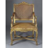 An English carved giltwood frame fauteuil by Morant & Co., 91, New Bond St., London, in the George I