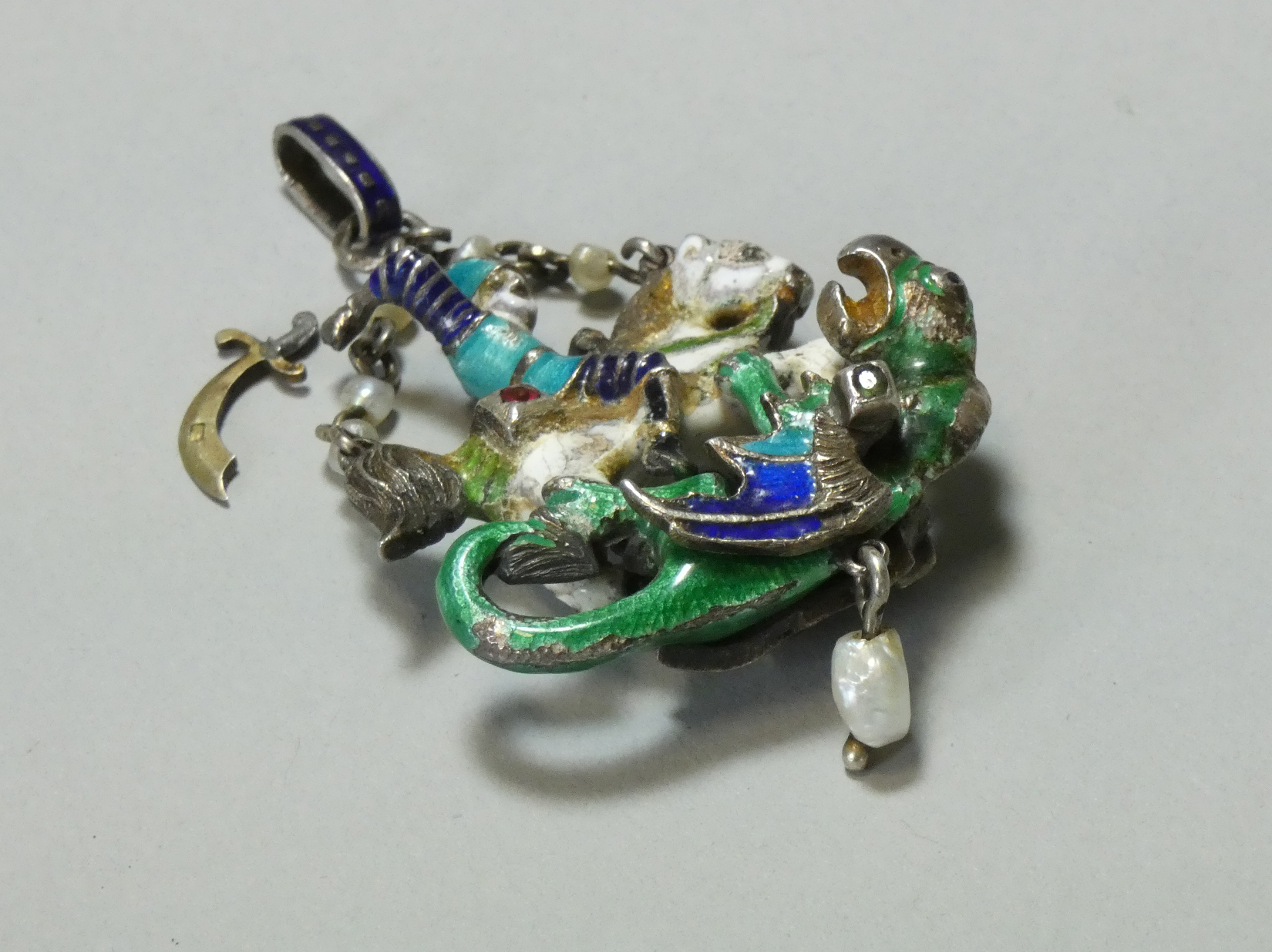 An Austro-Hungarian enamelled white metal pendant depicting St. George slaying the Dragon, - Image 3 of 3