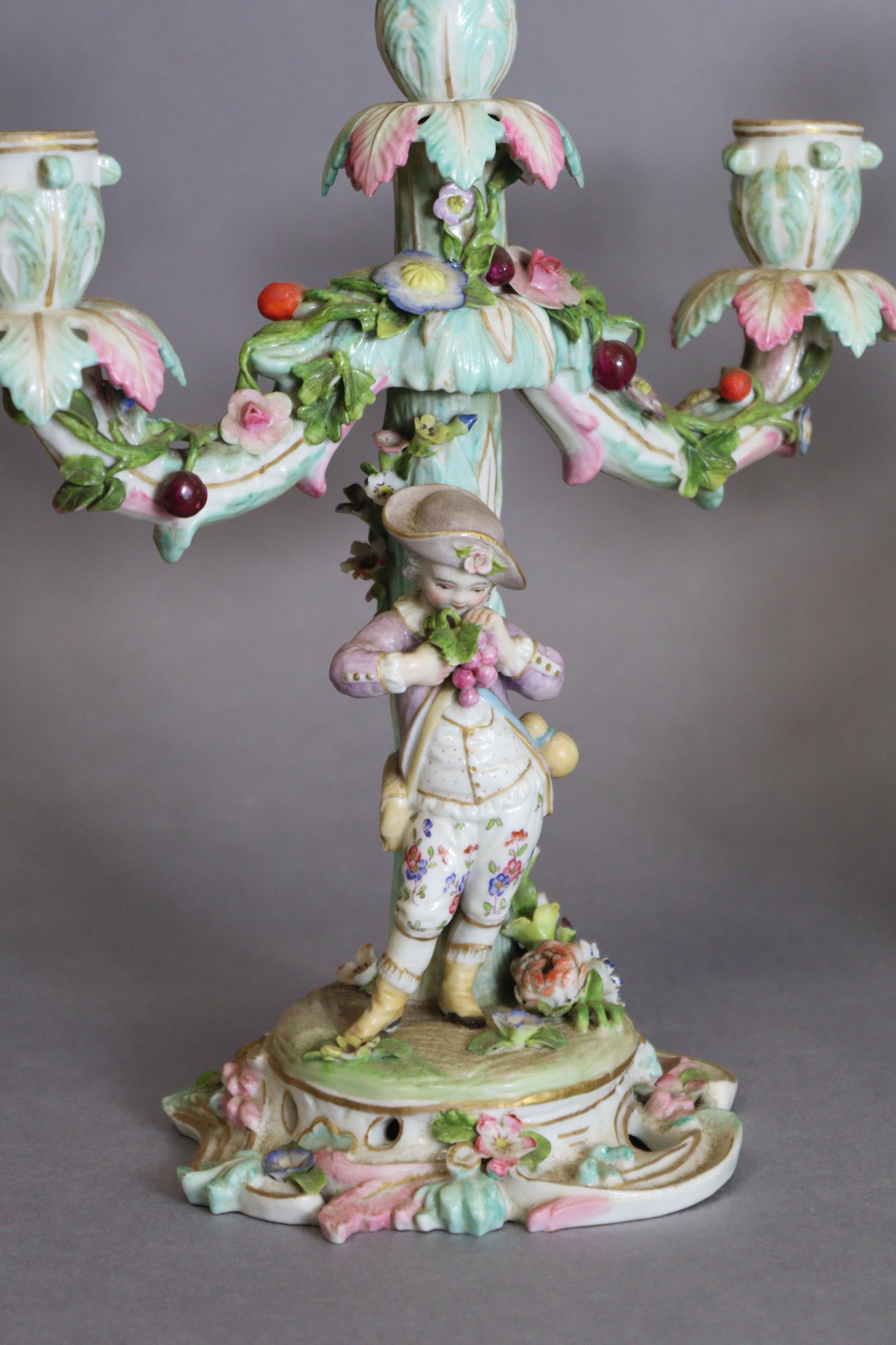 A pair of Meissen porcelain three-branch floral-encrusted candelabra, one with a girl holding a - Image 3 of 11