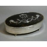 A George V silver large oval trinket box, the hinged tortoiseshell lid with inlaid silver birds,