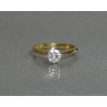 A diamond solitaire, the round-cut stone weighing approx. 0.5 carat, set to an 18ct yellow gold