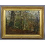 ENGLISH SCHOOL, 19th century. A wooded landscape with buildings in the distance; oil on canvas: 20¼”
