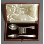 A silver christening set of feather-edge spoon, fork, & napkin ring, in fitted case; London 1936