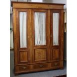 A late 19th/early 20th century Continental inlaid walnut wardrobe…