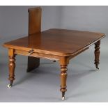 An early Victorian mahogany extending dining table with wind-out action & two additional leaves,