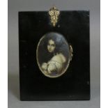 CONTINENTAL SCHOOL, mid-19th century. A half-length portrait miniature of a young woman wearing a