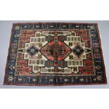 A Northwest Persian Nahavand rug of ivory ground with central medallion surrounded by geometric