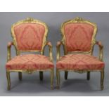 A pair of giltwood frame elbow chairs in the 18th century French style, with padded seats, backs &