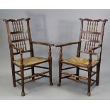Two 19th century Lancashire-type spindle-back elbow chairs with woven rush seats, & on turned &