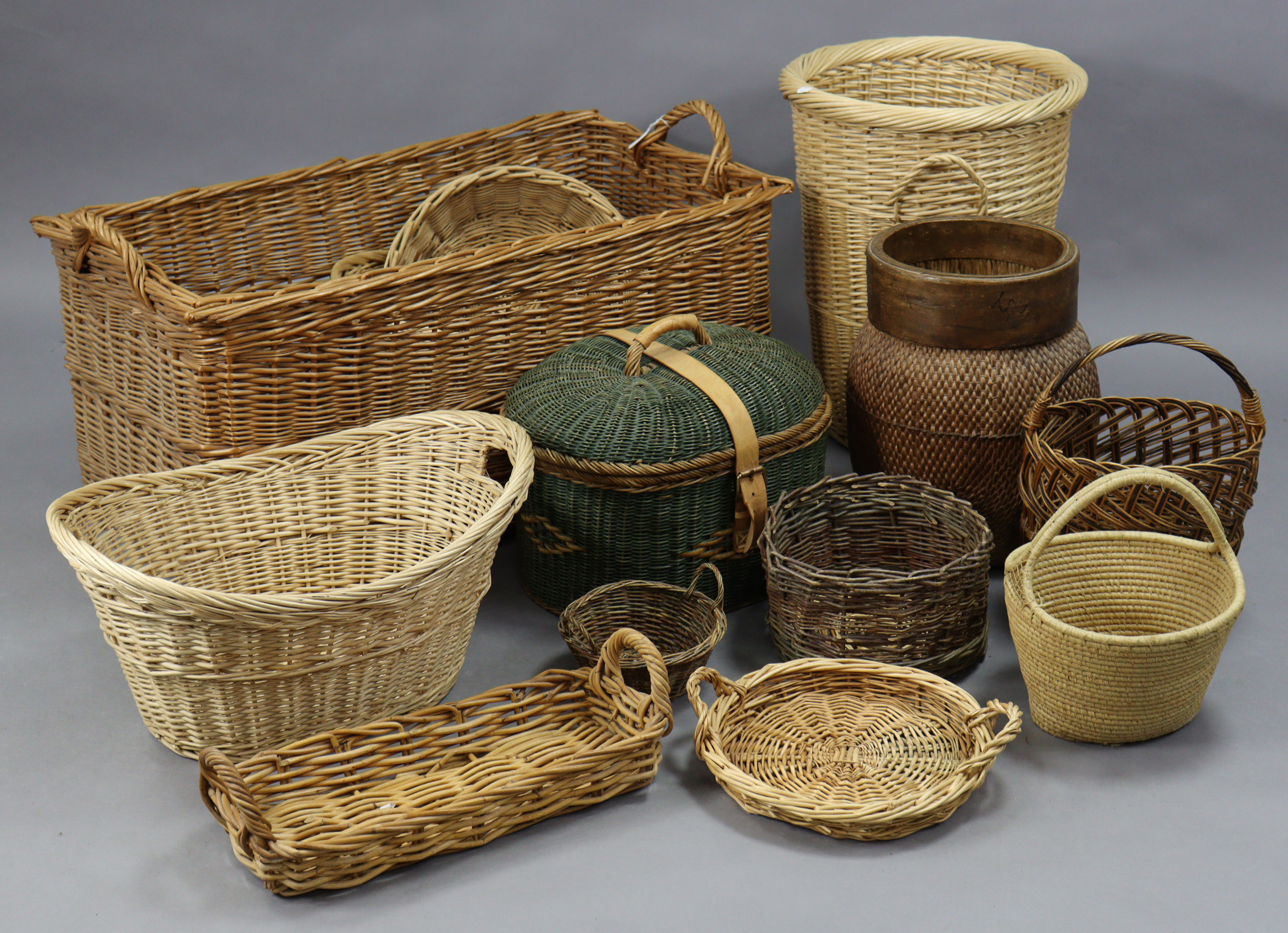 A large wicker rectangular two-handled laundry basket, 40” wide; together with various other