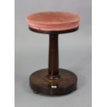 A William IV rosewood stool with a padded circular revolving seat, & on a round tapered centre