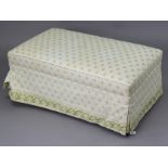 A rectangular box ottoman with a hinged lift-top upholstered white & green geometric material, &