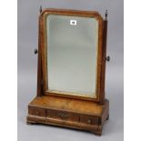 An 18th century walnut rectangular swing toilet mirror inset gilt inner slip, & fitted with three