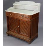 A late 19th century pitch pine marble-top washstand fitted two frieze drawers above cupboard