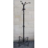 A wrought-metal hat & coat stand, 72½” high; & a similar elbow garden chair.