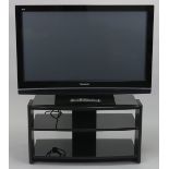 A Panasonic “Viera” 42 HDMI television with a remote control, & stand.