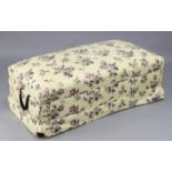 An early/mid 20th century box ottoman upholstered multi-coloured floral material, 48” wide x 15”