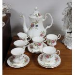 A Royal Albert bone china “Moss Rose” thirteen-piece part coffee service.