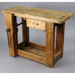 A small pine work-bench with a rectangular top, fitted with a frieze drawer, & on square supports, &