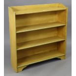 A small four-tier standing open bookcase, 37¼” wide x 38½” high x 10” deep.