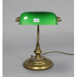An Edwardian-style brass desk lamp, with glass revolving shade, 13” high; a copper pan; a copper