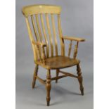 A similar Victorian beech lath-back elbow chair with a hard seat, & on turned legs with spindle