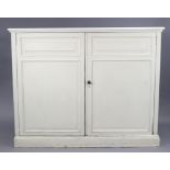 A WHITE PAINTED MAHOGANY HALL CUPBOARD by GILLOWS OF LANCASTER, enclosed by a pair of carved fielded