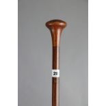 A vintage inlaid-hardwood gent’s walking cane, 34½” high.