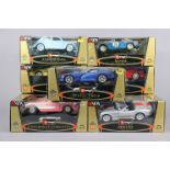 Nine Burago large scale die-cast Gold collection model sports cars, each with window box.