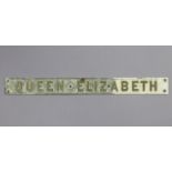 A mid-20th century painted bronzed name plaque “QUEEN ELIZABETH” (reputedly from the Cunard line
