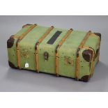 A vintage canvas-covered & leather-bound ribbed travelling trunk with tray & fitted with a pair of