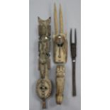 An African carved wood sculpture of a lioness, 16¾” long x 7” high; two African carved wood masks; &